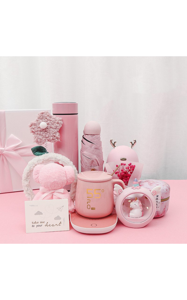 A practical pink gift set including a gift box, a mug with a smart electric water heater